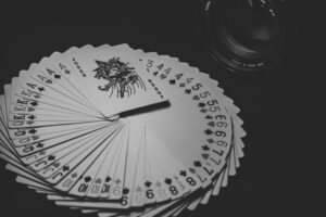 Playing cards laid out in a circle - not breaking the circle is critical in the King of Cup rules.